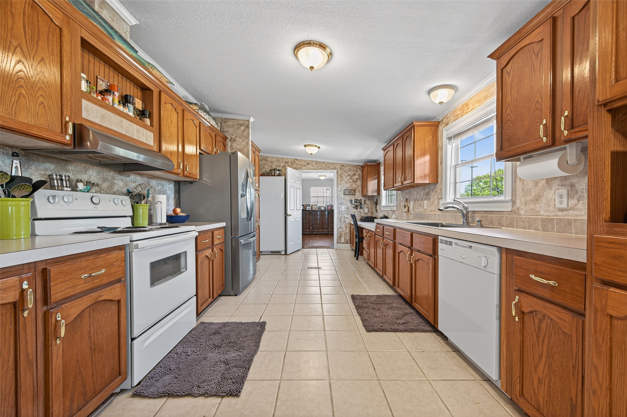 32445 Knebel Road Waller, TX 77484 - Photo 24 of 49 a kitchen with stainless steel appliances granite countertop a sink and cabinets