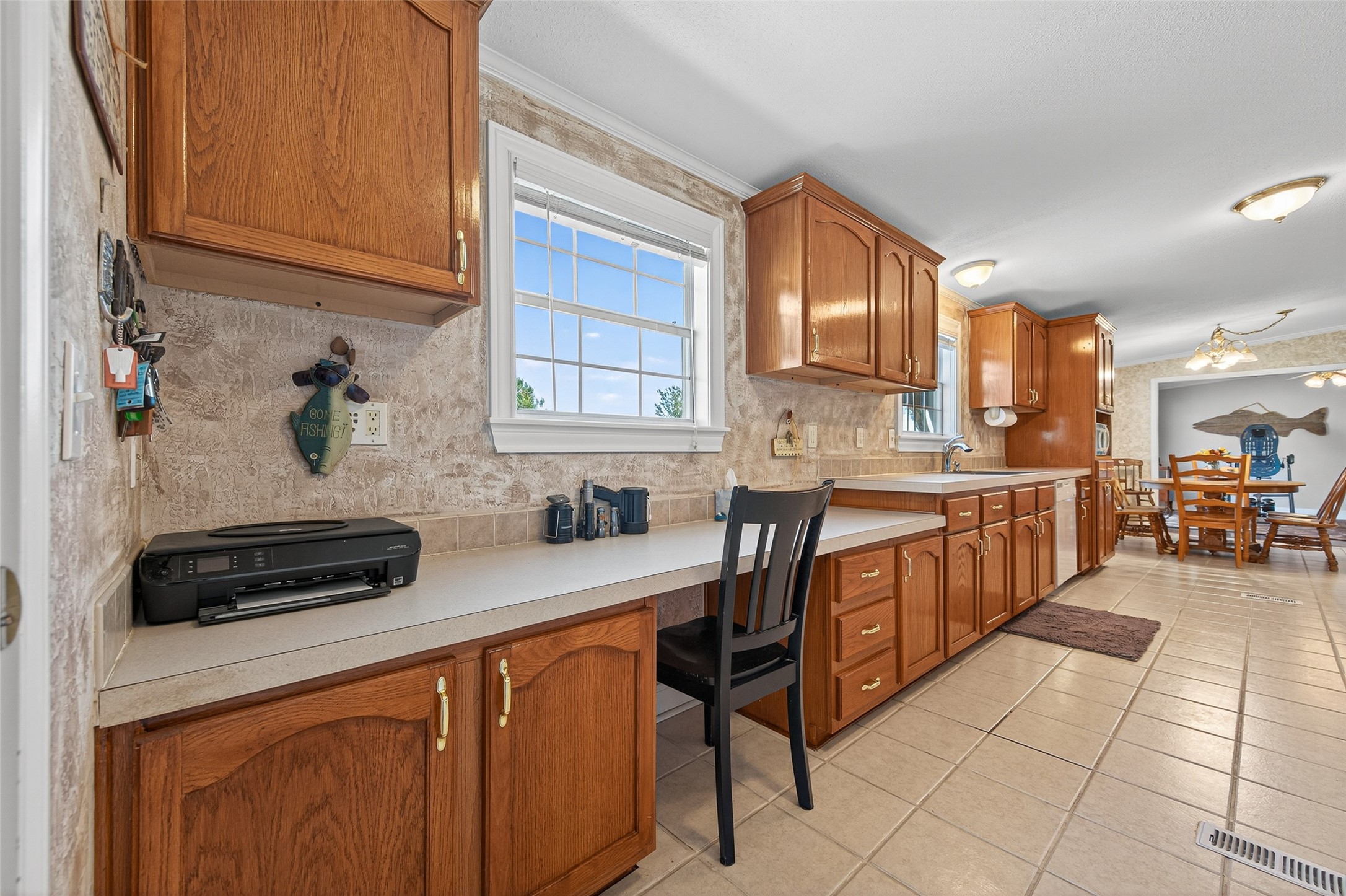 32445 Knebel Road Waller, TX 77484 - Photo 26 of 49 a kitchen with stainless steel appliances a stove a sink a microwave and cabinets