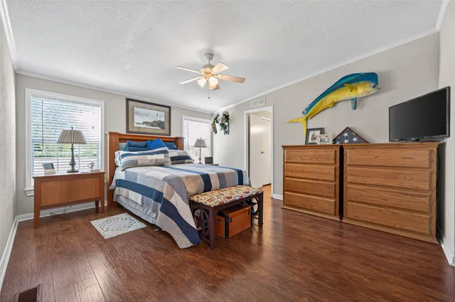 a spacious bedroom with a bed and window