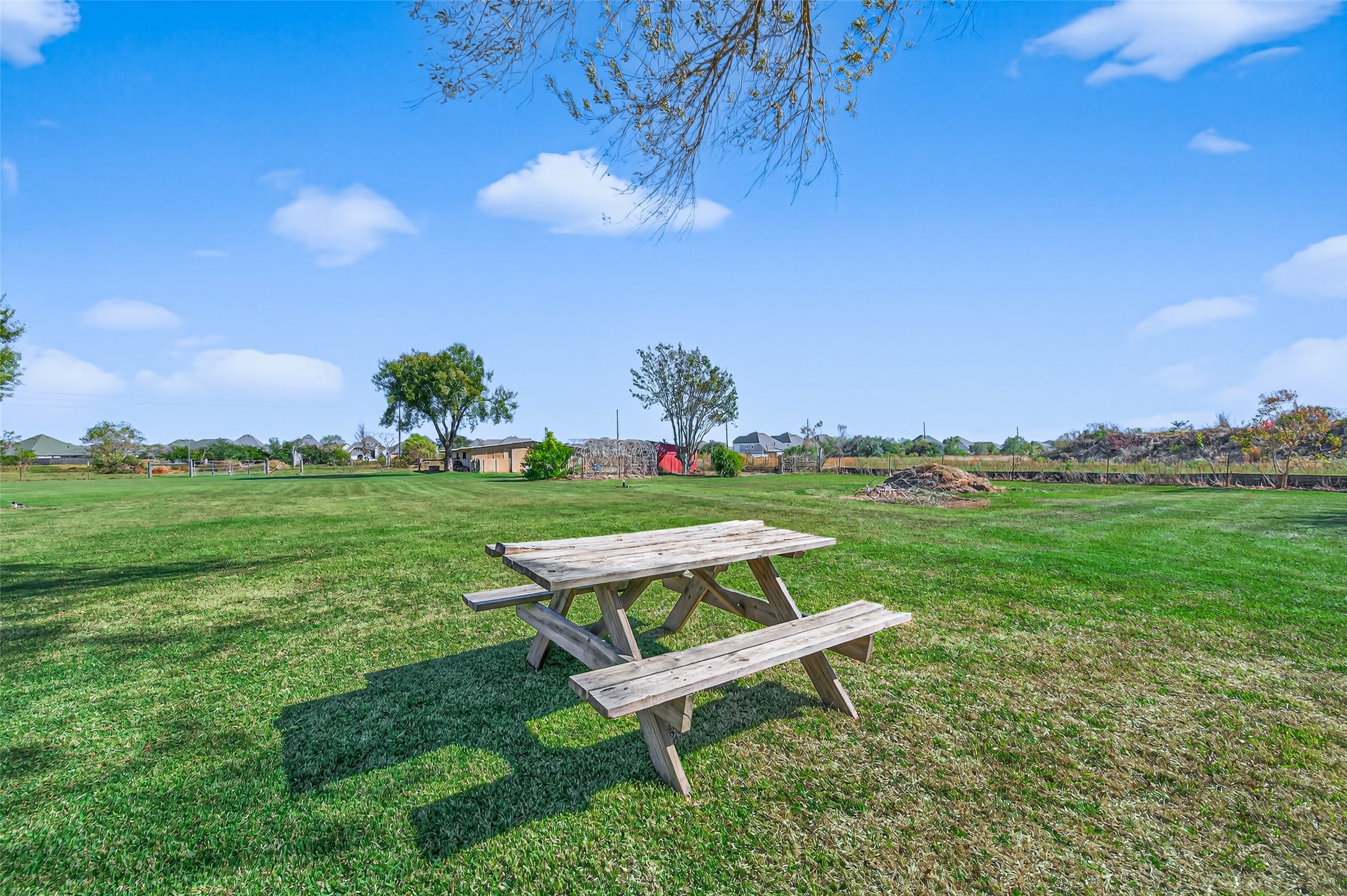32445 Knebel Road Waller, TX 77484 - Photo 36 of 49 a wooden bench sitting in a grassy field