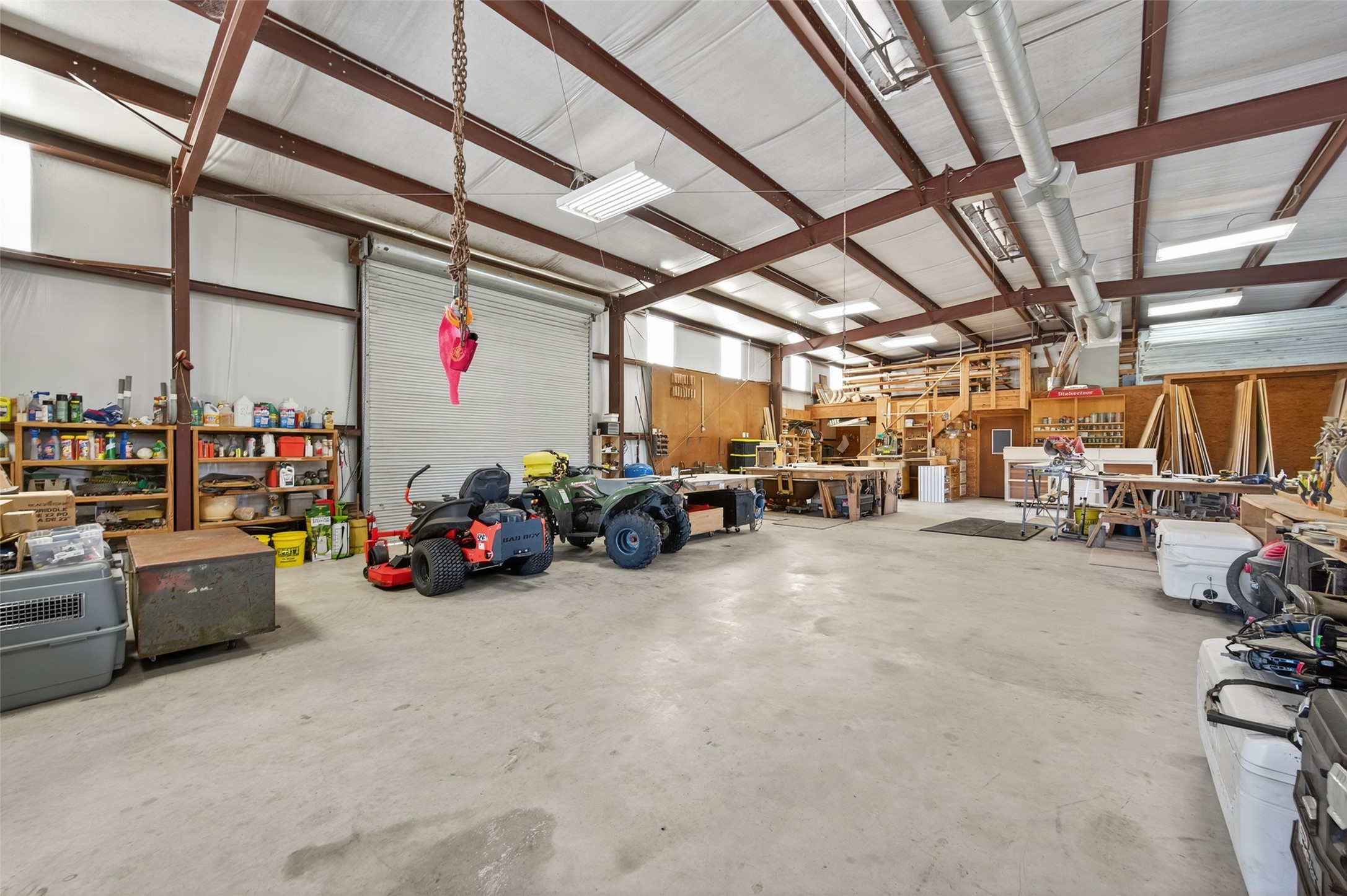32445 Knebel Road Waller, TX 77484 - Photo 44 of 49 a view of parking garage with cars and other equipment