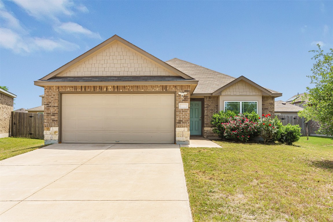 5953 Malta Circle Round Rock, TX 78665 - Photo 1 of 1 a front view of a house with garden