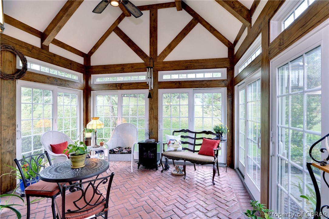 4220 Old Lock Road Williamsburg, VA 23188 - Photo 15 of 45 The custom-built 3 season sunporch features a stamped concrete floor, wood beamed Cathedral ceiling and access to the back patio.