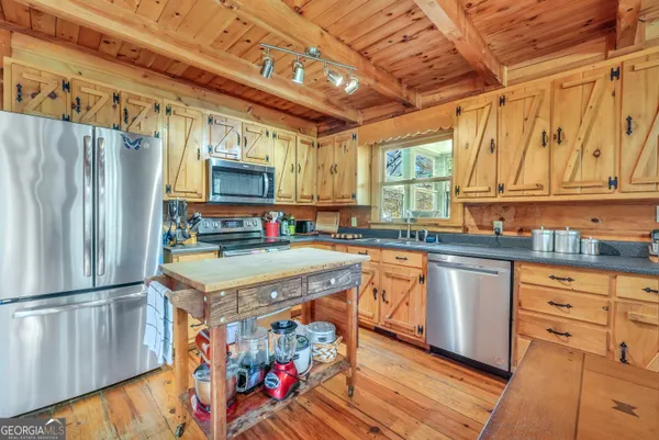 a view of a kitchen with furniture and a table