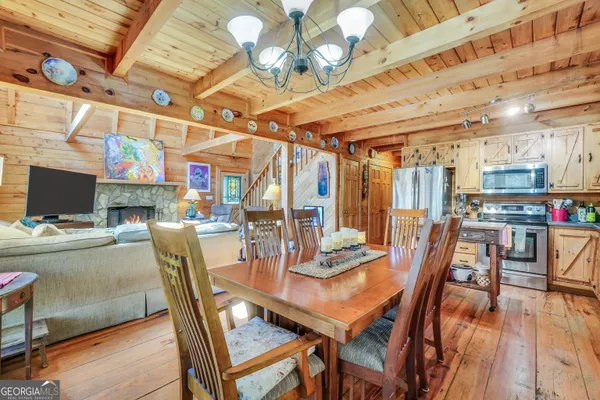 a view of a chairs and table on the deck