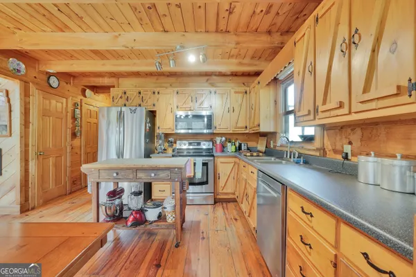 a bedroom with furniture and a flat screen tv