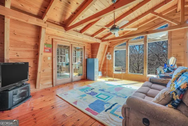 a bathroom with a sink a mirror and a shower