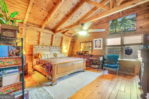 a view of an empty room with a ceiling fan
