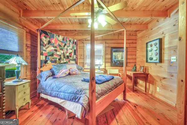 a bathroom with a sink mirror and toilet
