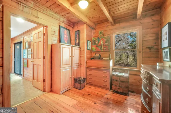 a view of a lake with houses in the background