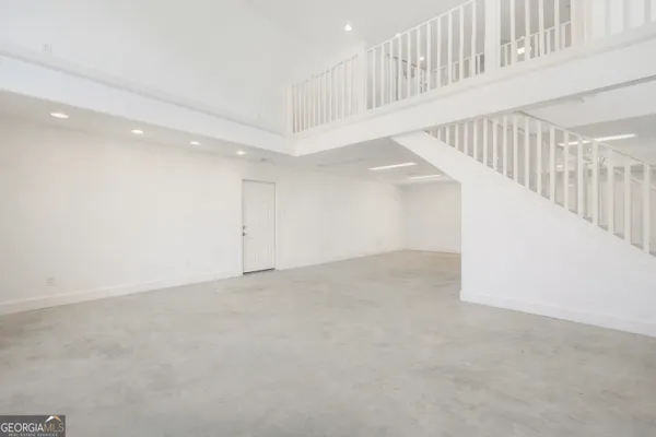 an aerial view of a house with a lake view