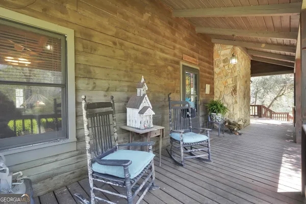 a view of a yard with trees and sitting area