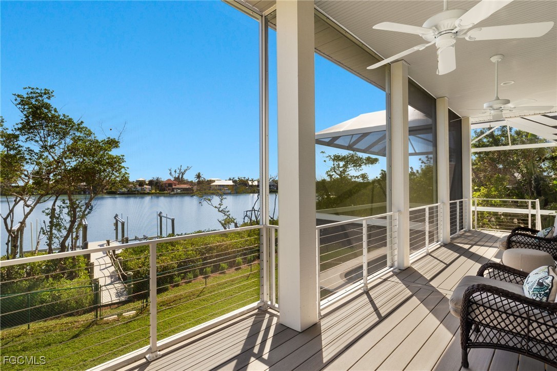 2400 Los Colony Road Sanibel, FL 33957 - Photo 16 of 50 a view of a balcony with dining table & chairs