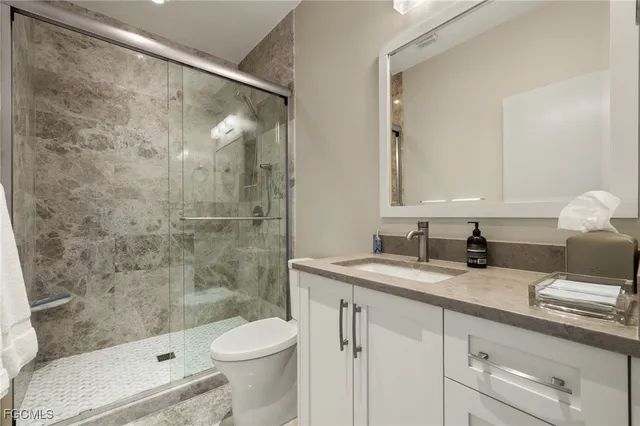 a kitchen with a sink a stove and cabinets