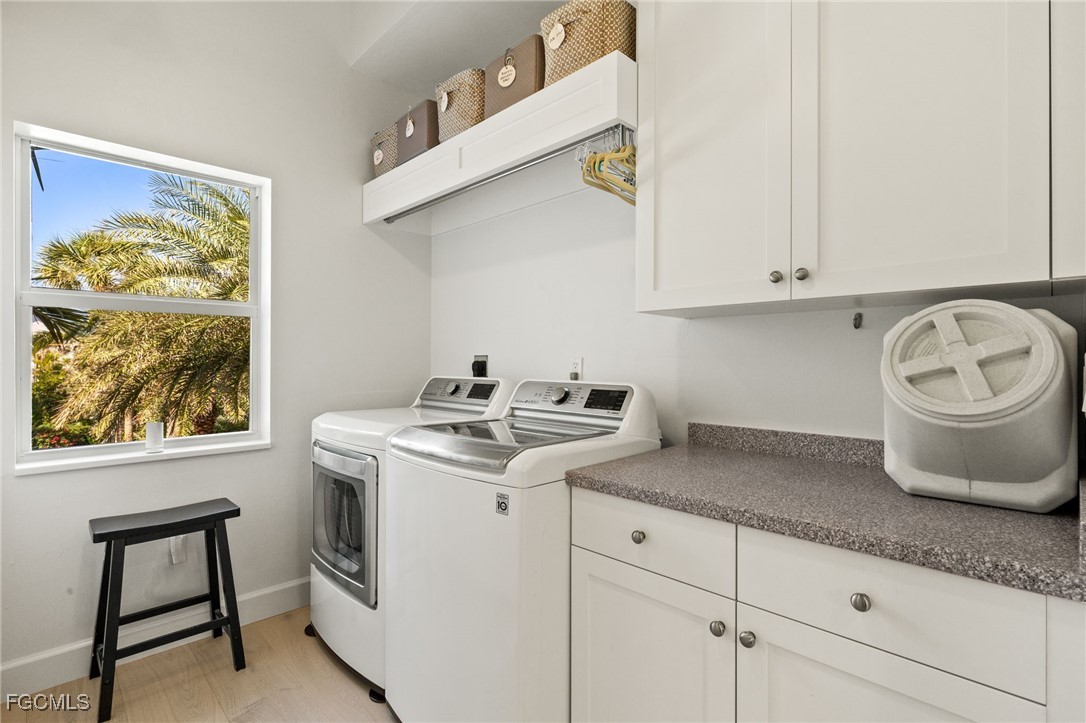 2400 Los Colony Road Sanibel, FL 33957 - Photo 29 of 50 a kitchen with a sink a stove and cabinets