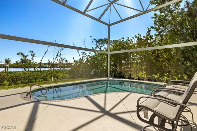 a view of a swimming pool with a patio