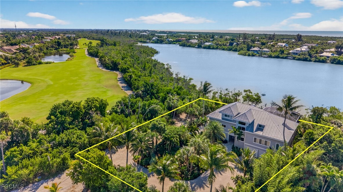 2400 Los Colony Road Sanibel, FL 33957 - Photo 44 of 50 an aerial view of a house with a lake view
