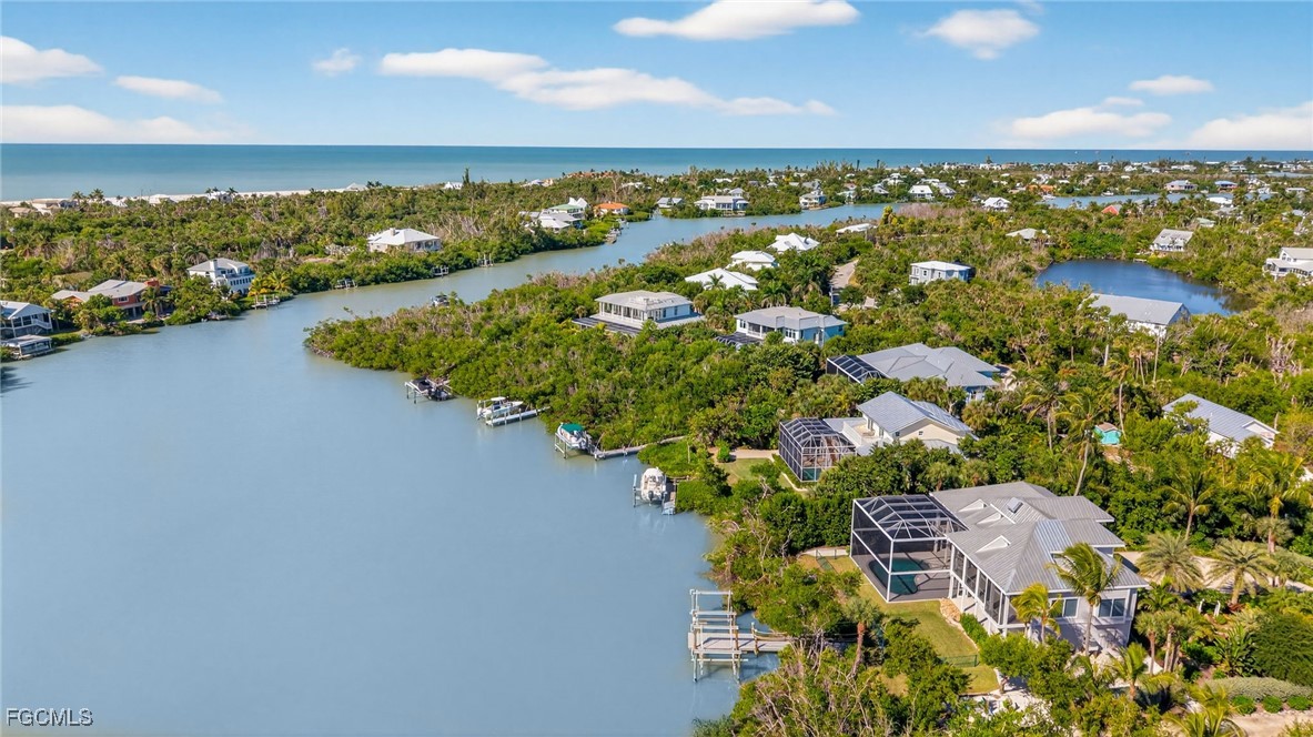2400 Los Colony Road Sanibel, FL 33957 - Photo 48 of 50 an aerial view of a houses with a lake view