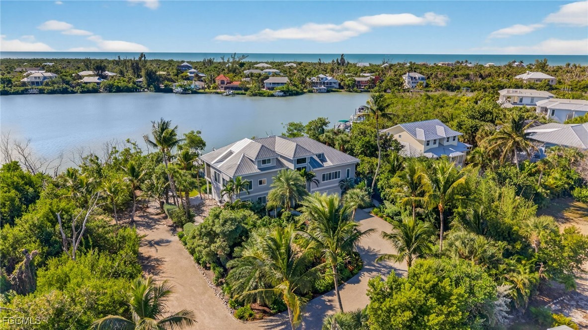 2400 Los Colony Road Sanibel, FL 33957 - Photo 50 of 50 an aerial view of a houses with a lake view