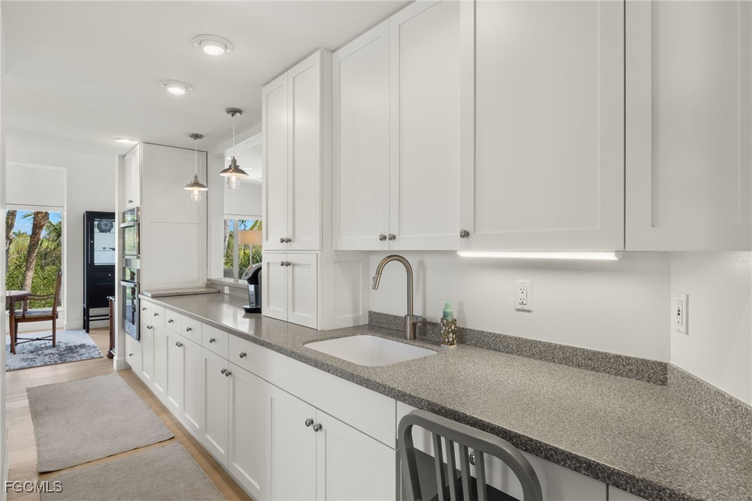 2400 Los Colony Road Sanibel, FL 33957 - Photo 10 of 50 a kitchen with counter top space and cabinets