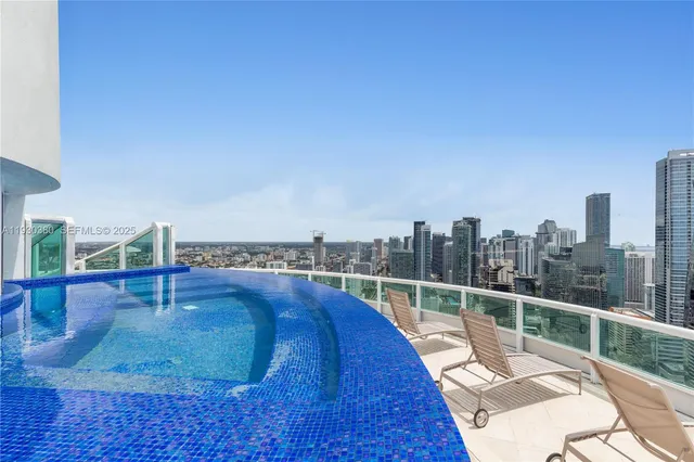 a living room with fireplace furniture and a flat screen tv