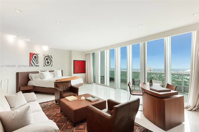 a view of a dining room with furniture and window