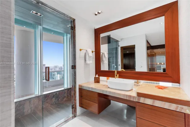 a picture of a bathroom with a sink and a mirror