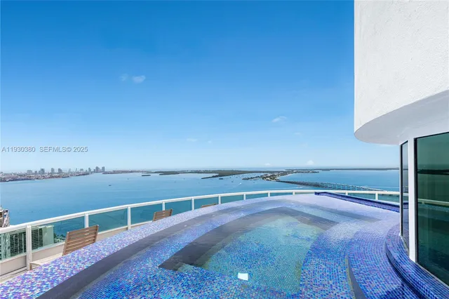 a hallway with a large mirror and a shower curtain