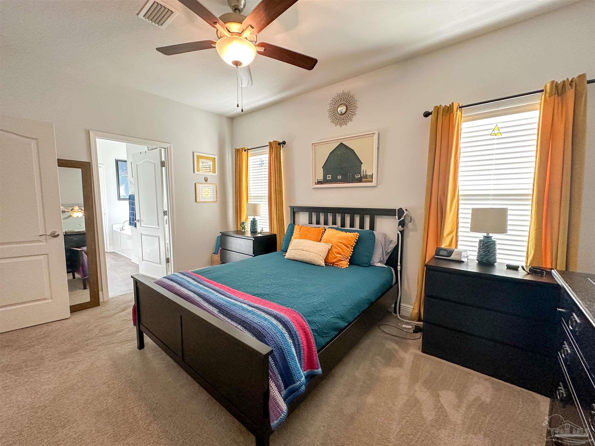 3613 Conley Drive Cantonment, FL 32533 - Photo 12 of 23 a bedroom with a bed and window
