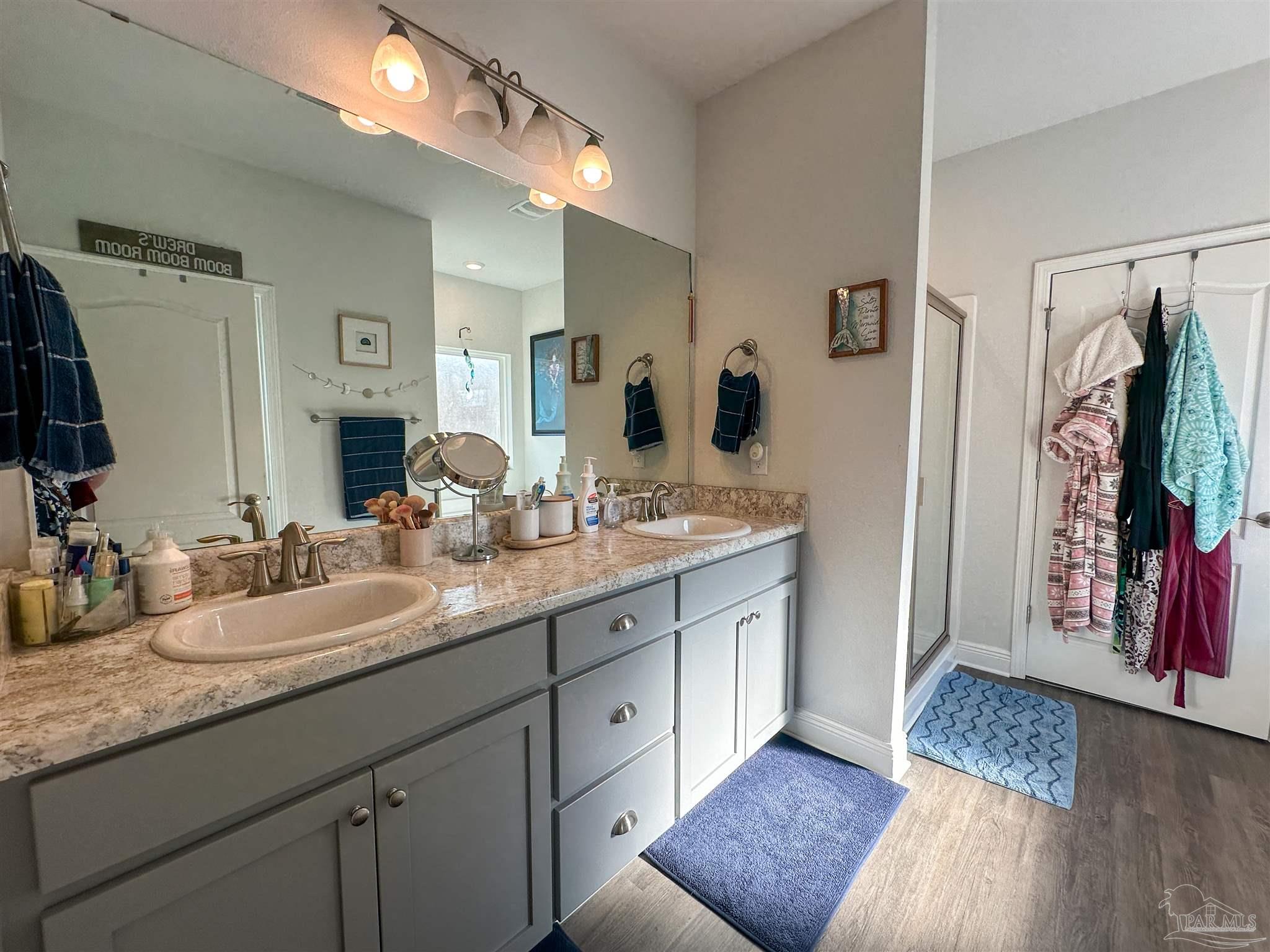 3613 Conley Drive Cantonment, FL 32533 - Photo 13 of 23 a en suite bathroom with double vanity and a mirror