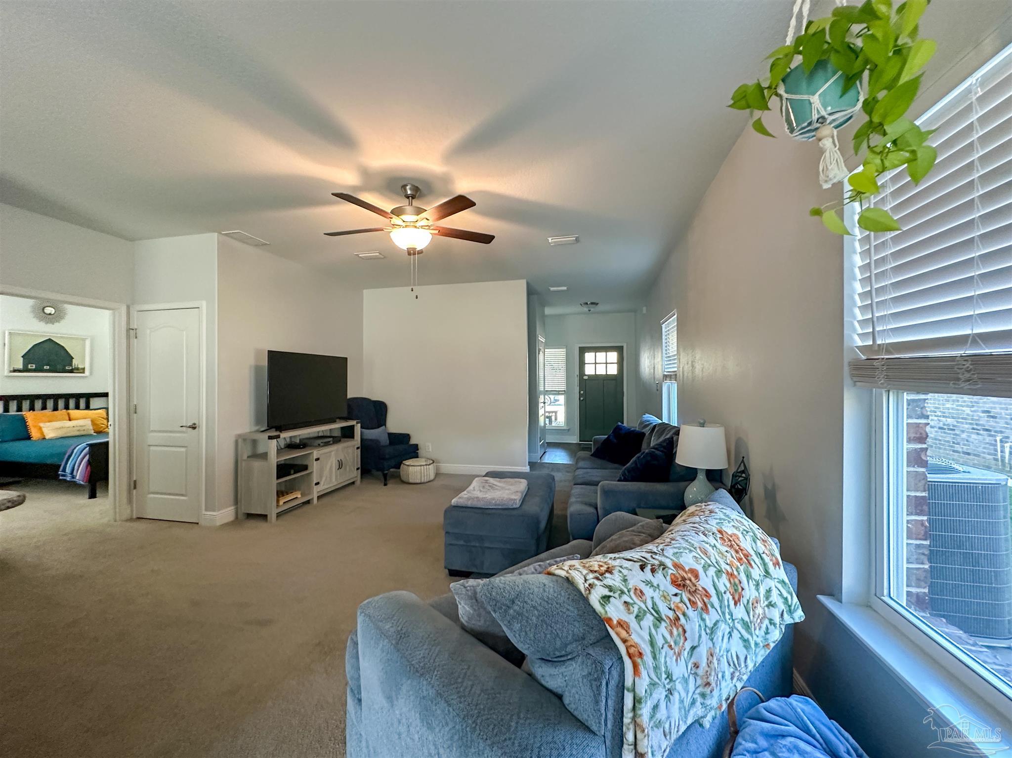 3613 Conley Drive Cantonment, FL 32533 - Photo 17 of 23 a living room with furniture and a flat screen tv