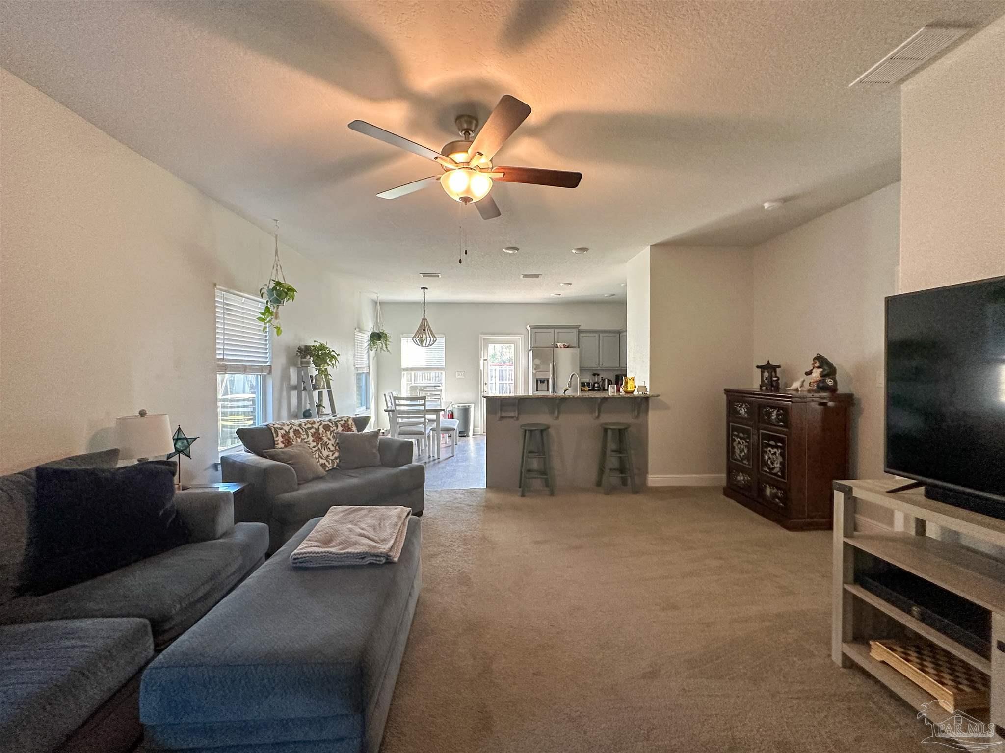 3613 Conley Drive Cantonment, FL 32533 - Photo 18 of 23 a living room with furniture and a flat screen tv