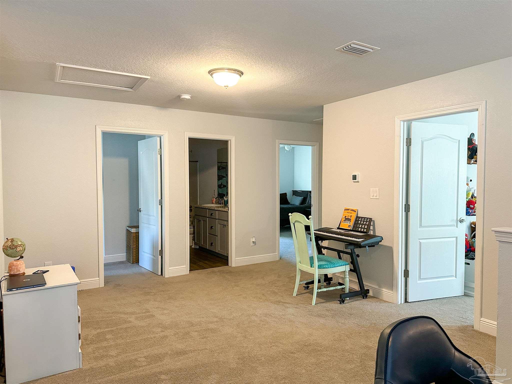 3613 Conley Drive Cantonment, FL 32533 - Photo 7 of 23 a living room with furniture and a chair