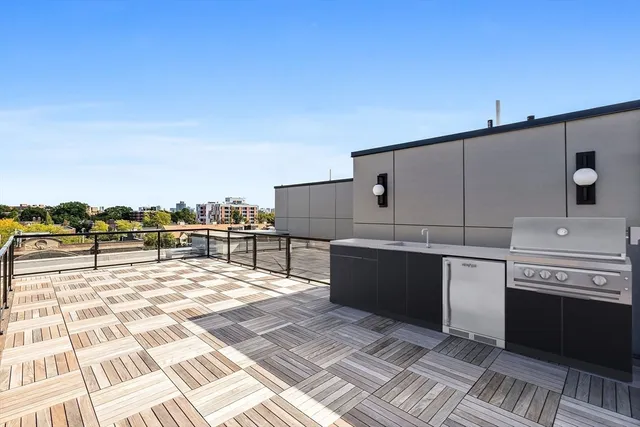 a view of balcony with wooden floor and city view