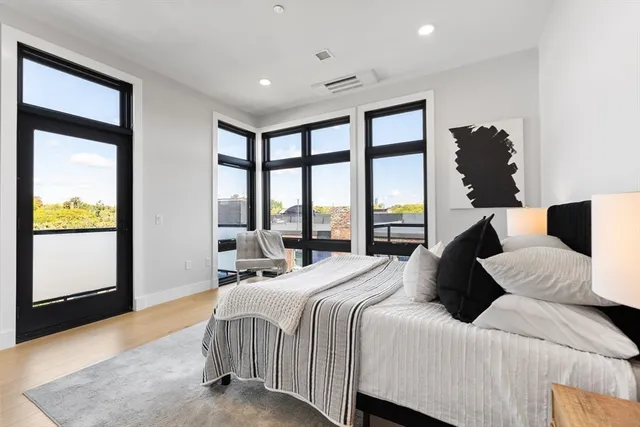 a bedroom with bed and a night stand