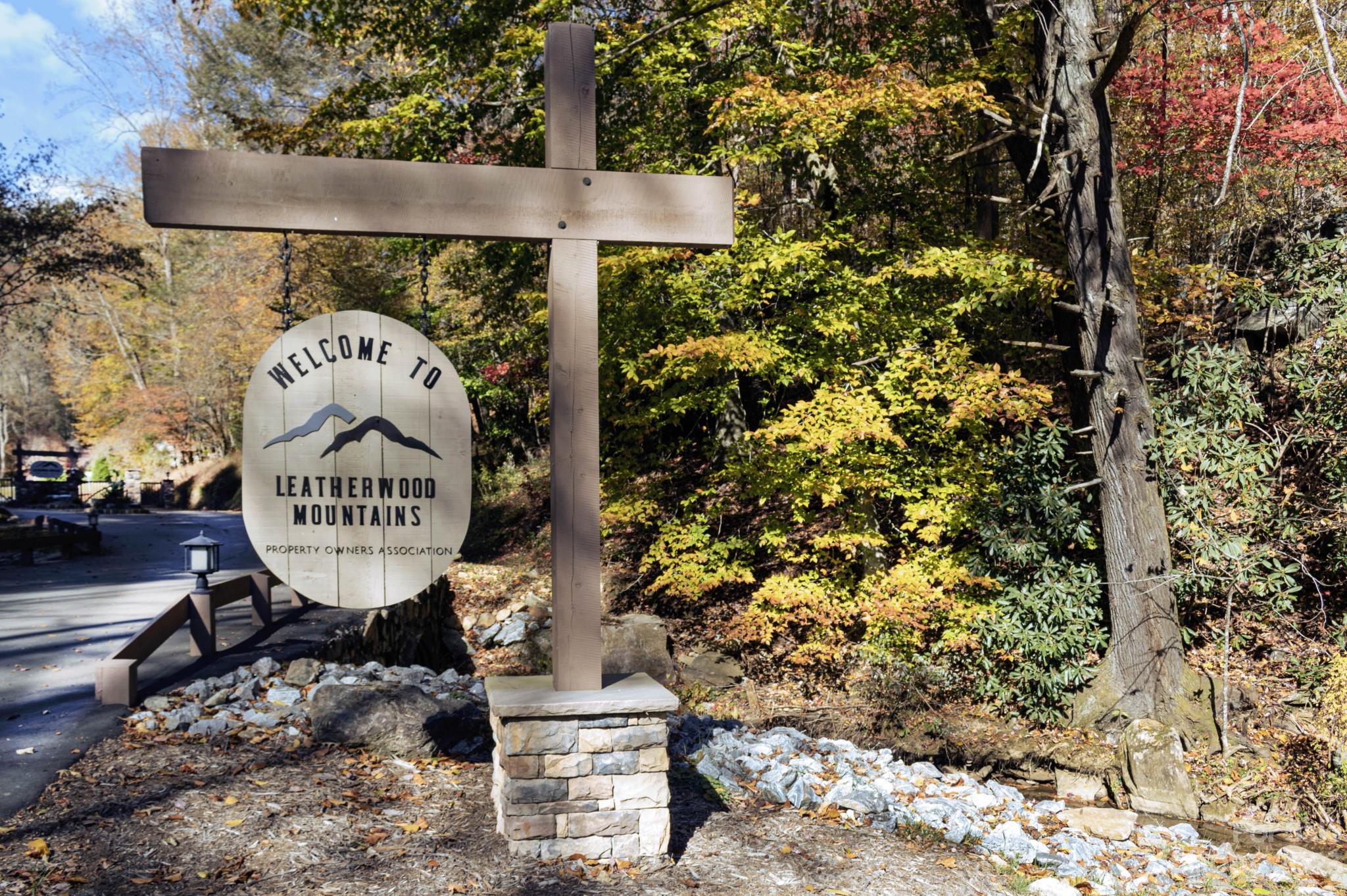 3675 Elk Ridge Road Ferguson, NC 28624 - Photo 2 of 12 a sign board with a small yard and large trees