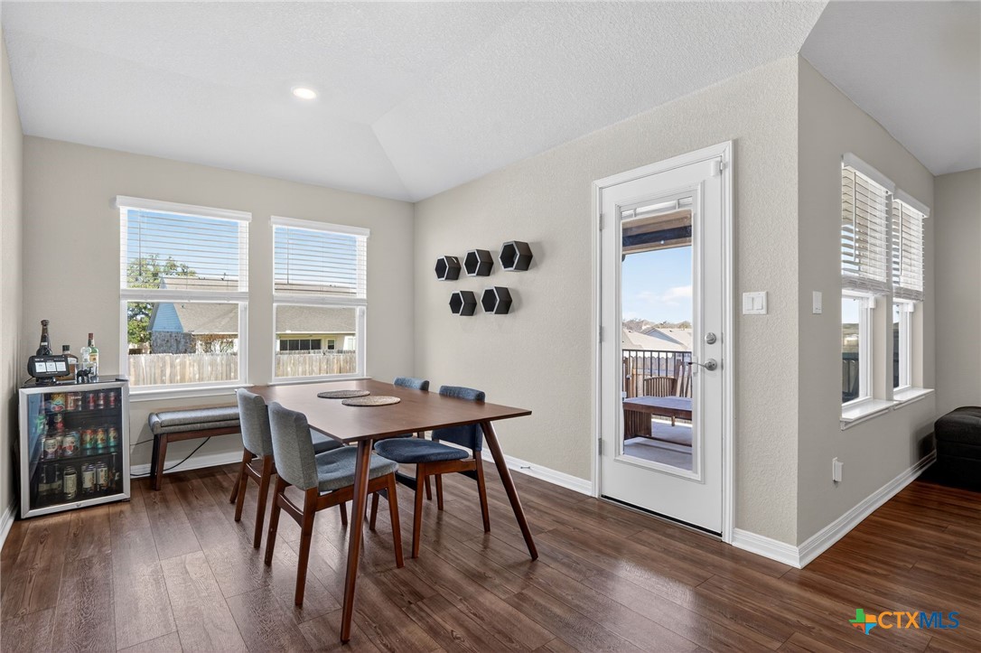1036 View Drive Georgetown, TX 78628 - Photo 11 of 33 a view of a dining room with furniture and wooden floor