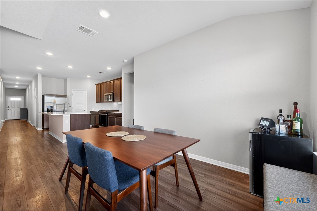 1036 View Drive Georgetown, TX 78628 - Photo 12 of 33 a dining room with furniture and wooden floor