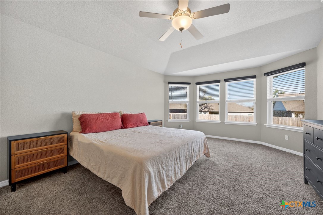 1036 View Drive Georgetown, TX 78628 - Photo 13 of 33 a bedroom with a large bed and a window