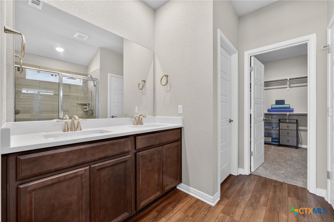 1036 View Drive Georgetown, TX 78628 - Photo 16 of 33 a bathroom with a sink and a mirror