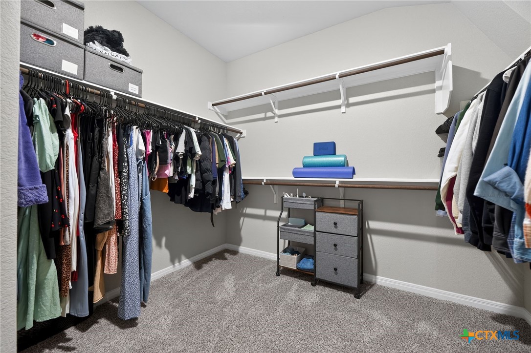 1036 View Drive Georgetown, TX 78628 - Photo 17 of 33 a view of walk in closet with clothes and shoes