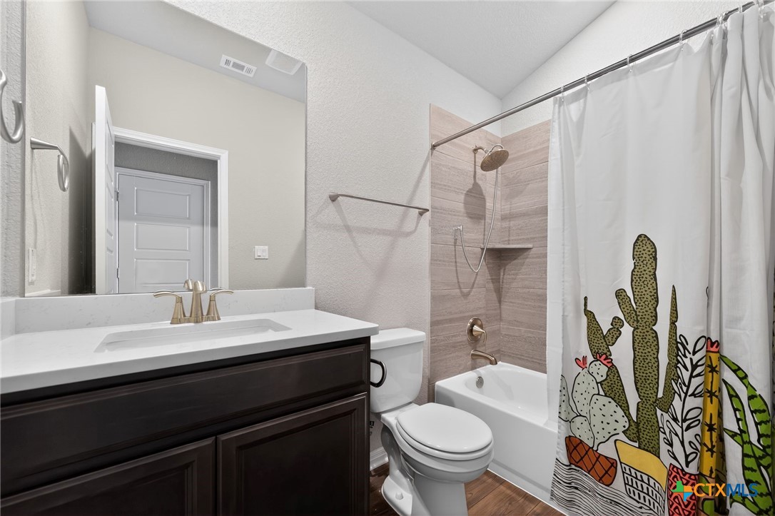 1036 View Drive Georgetown, TX 78628 - Photo 18 of 33 a bathroom with a sink a toilet and shower