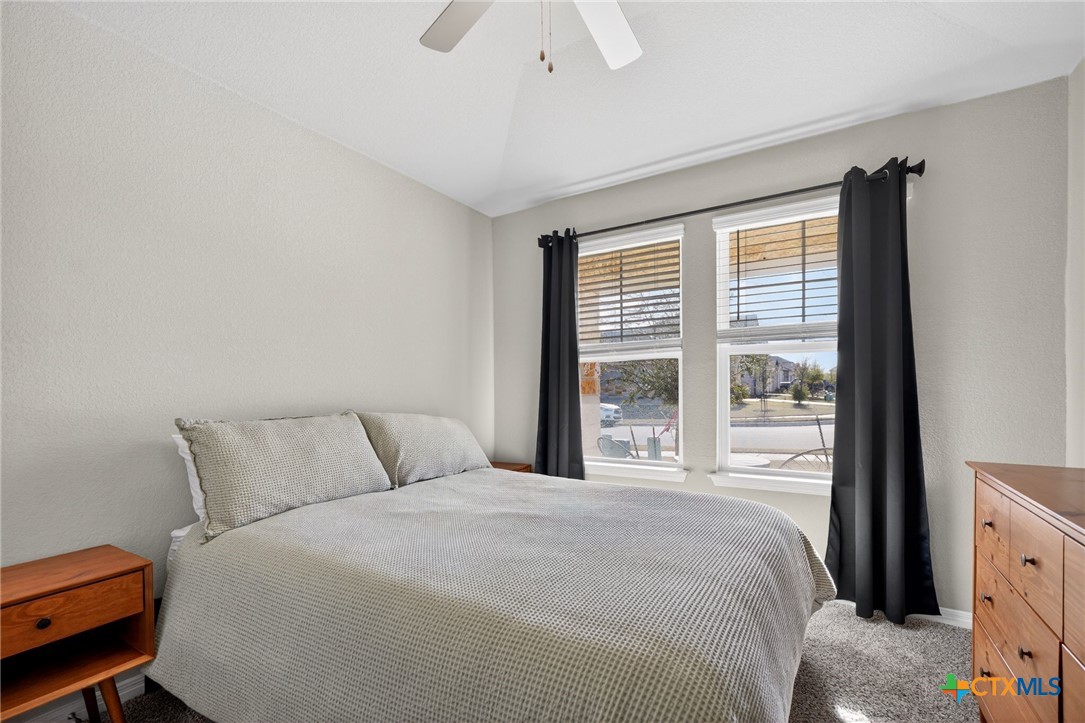 1036 View Drive Georgetown, TX 78628 - Photo 19 of 33 a bedroom with a bed and a window