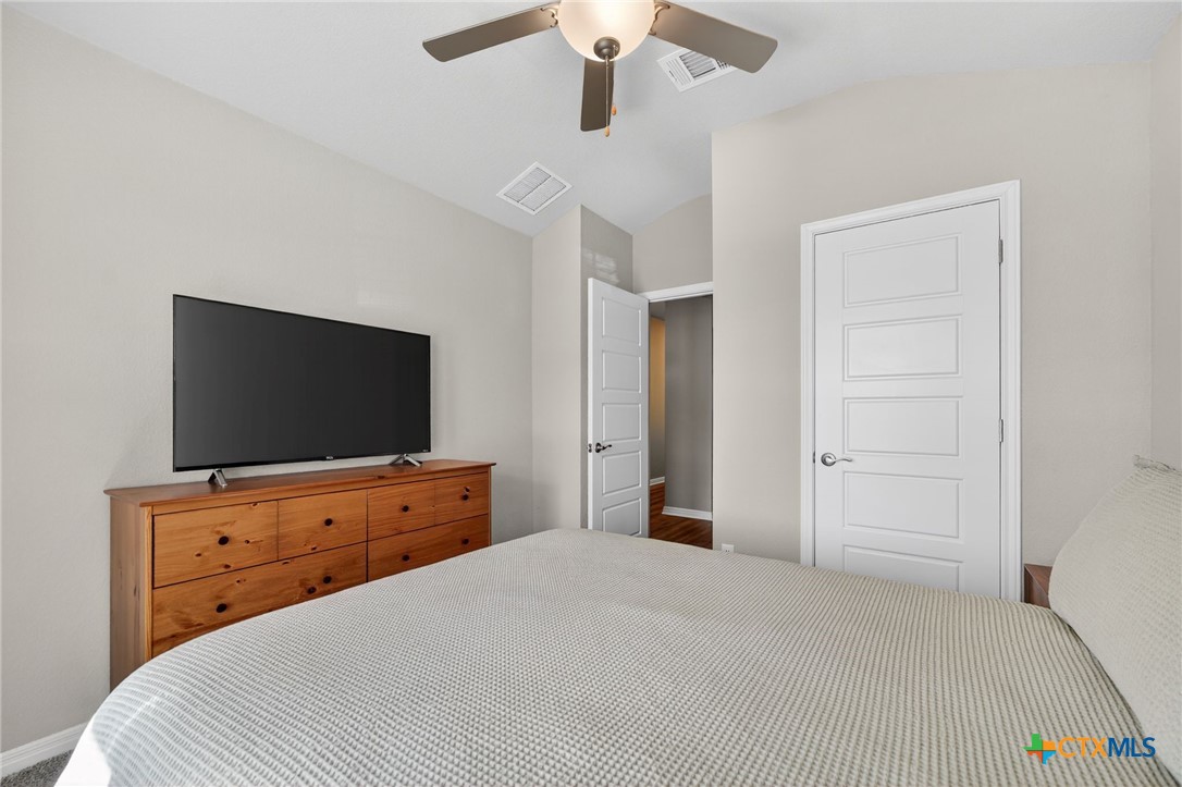 1036 View Drive Georgetown, TX 78628 - Photo 20 of 33 a bedroom with a bed and a flat screen tv