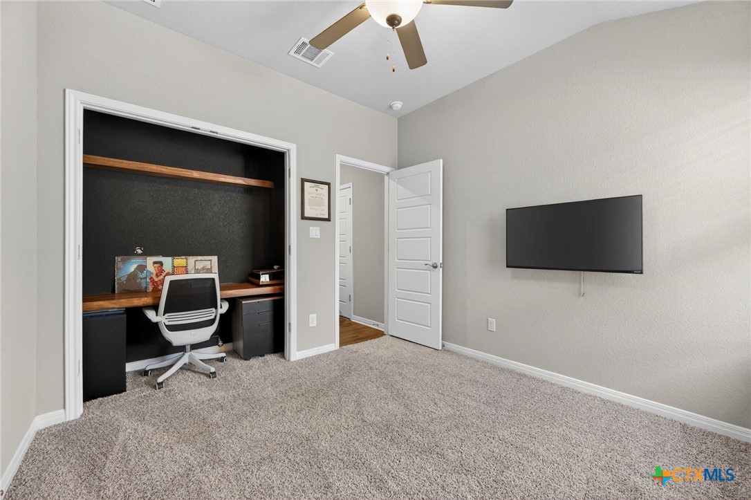 1036 View Drive Georgetown, TX 78628 - Photo 23 of 33 a workspace with a flat screen tv