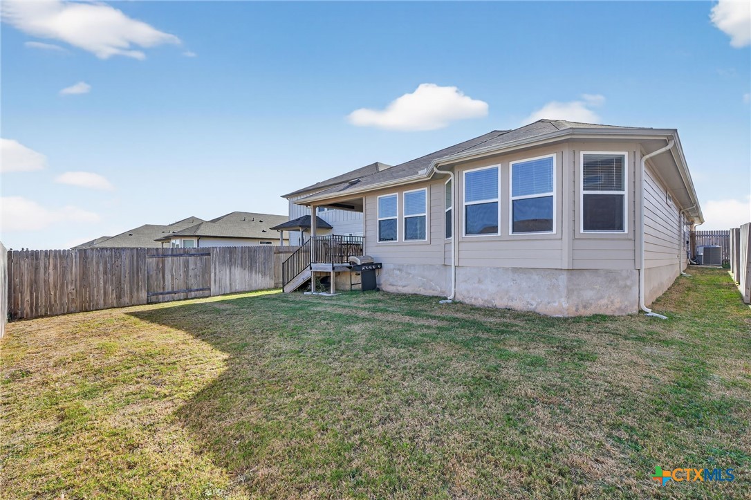 1036 View Drive Georgetown, TX 78628 - Photo 28 of 33 a view of a house with a backyard