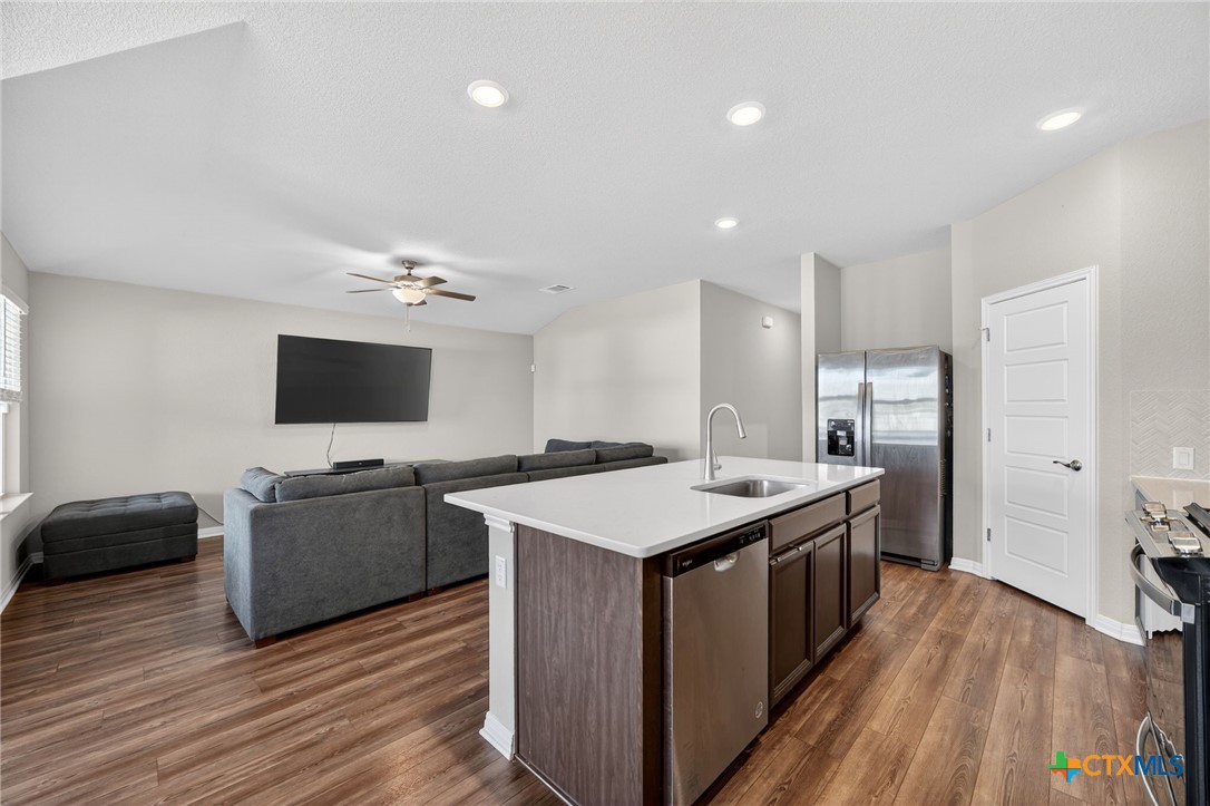 1036 View Drive Georgetown, TX 78628 - Photo 7 of 33 a kitchen with a stove and a microwave