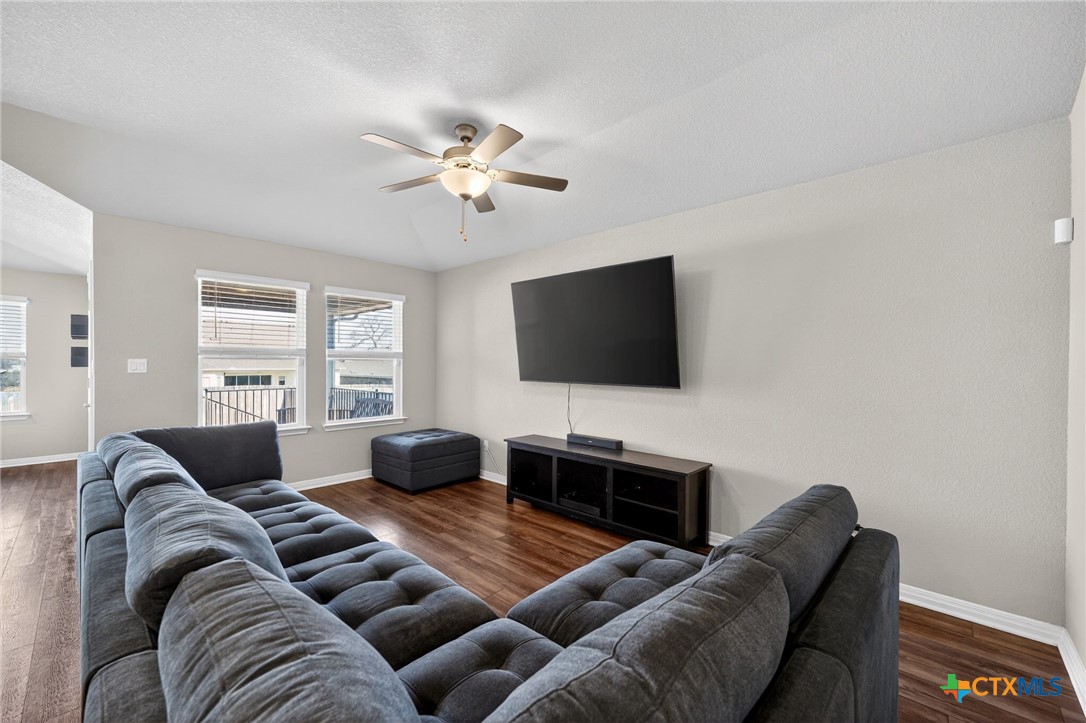 1036 View Drive Georgetown, TX 78628 - Photo 8 of 33 a living room with furniture and a flat screen tv