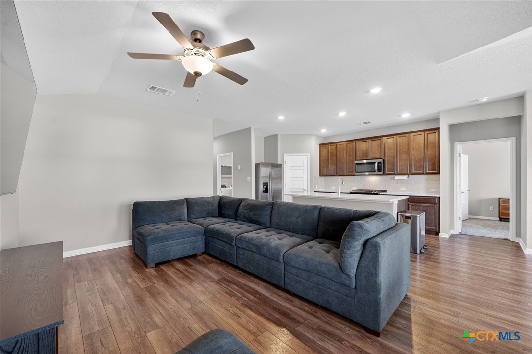 1036 View Drive Georgetown, TX 78628 - Photo 9 of 33 a living room with furniture and kitchen view
