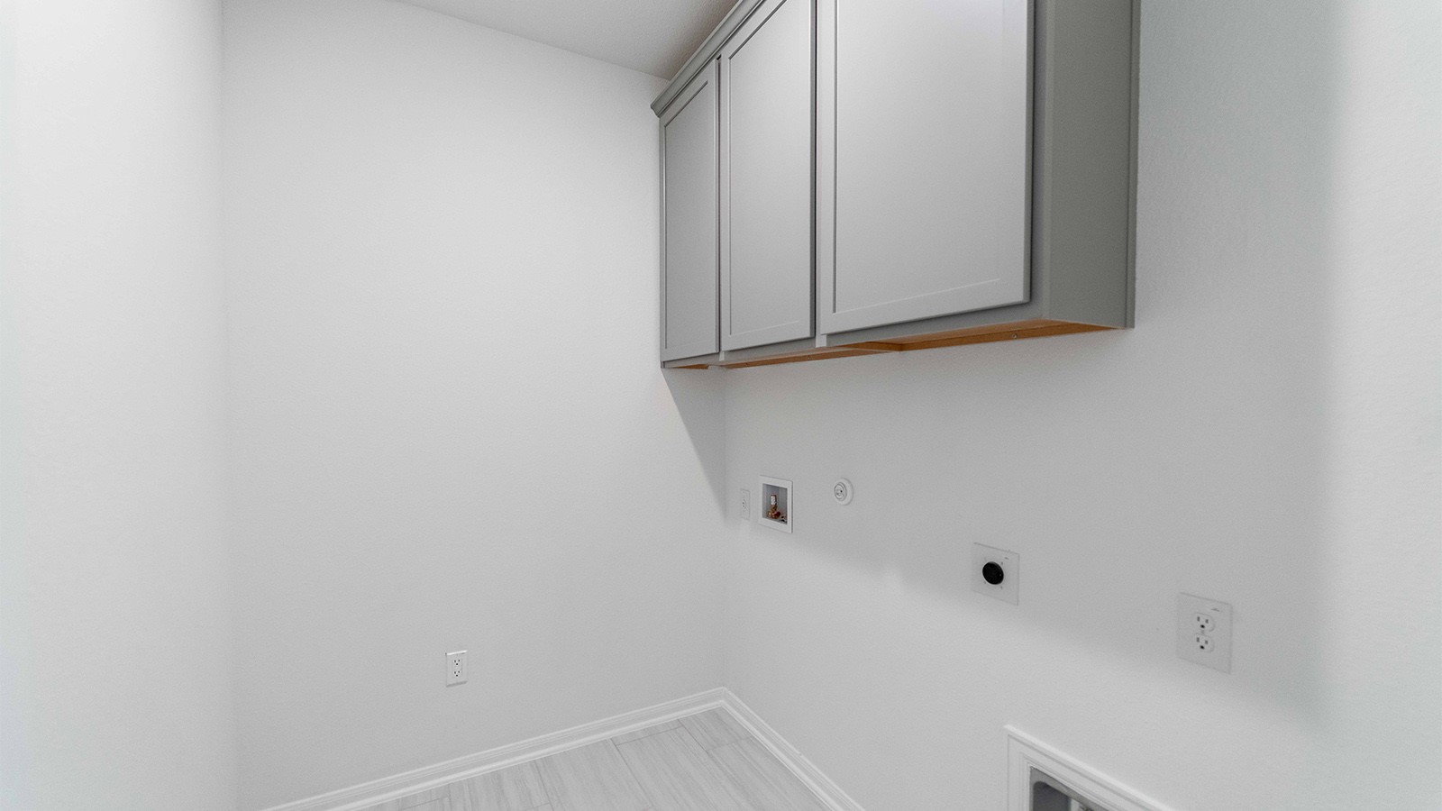 294 Rubber Tree Way Buda, TX 78610 - Photo 17 of 19 Laundry room with cabinet space, gas dryer hookup, hookup for an electric dryer, and washer hookup